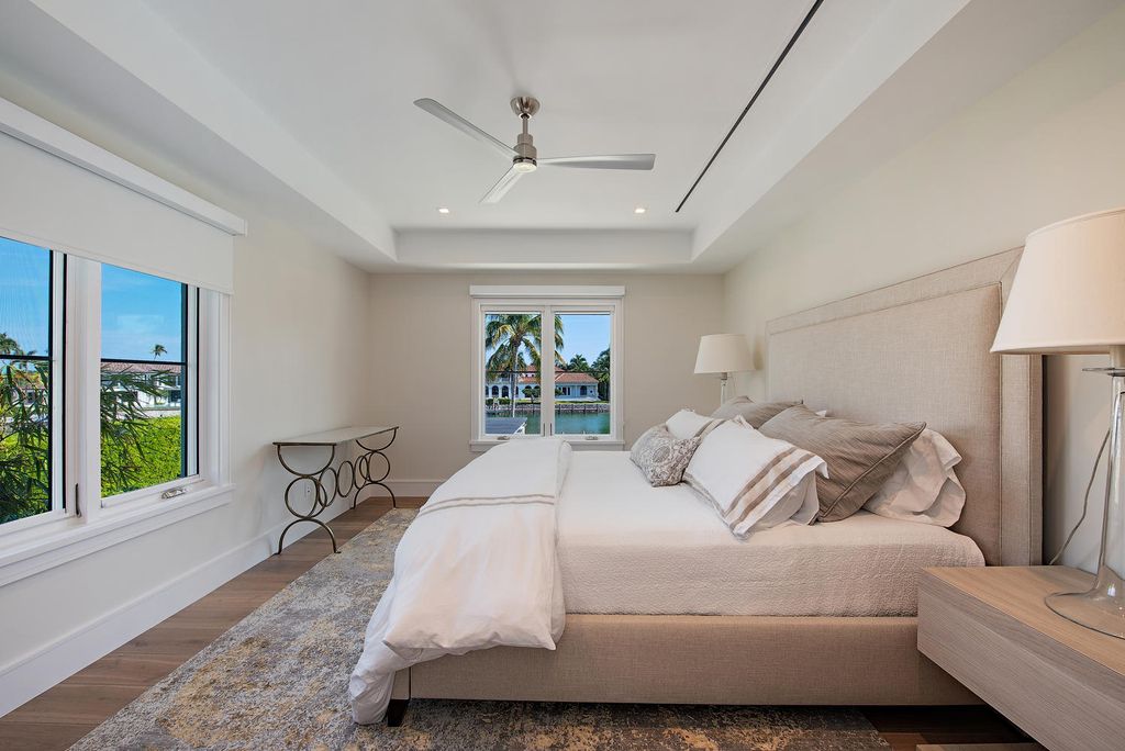 3595 Gin Lane, Naples, Florida is a gated property situated on nearly an acre overlooking Hidden Bay with quick access to the Gulf of Mexico, beautifully renovated and reimagined in 2018 with amenities as a private elevator, cherry wood library, double island in kitchen. 