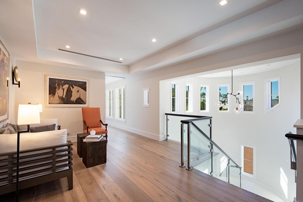 3595 Gin Lane, Naples, Florida is a gated property situated on nearly an acre overlooking Hidden Bay with quick access to the Gulf of Mexico, beautifully renovated and reimagined in 2018 with amenities as a private elevator, cherry wood library, double island in kitchen. 