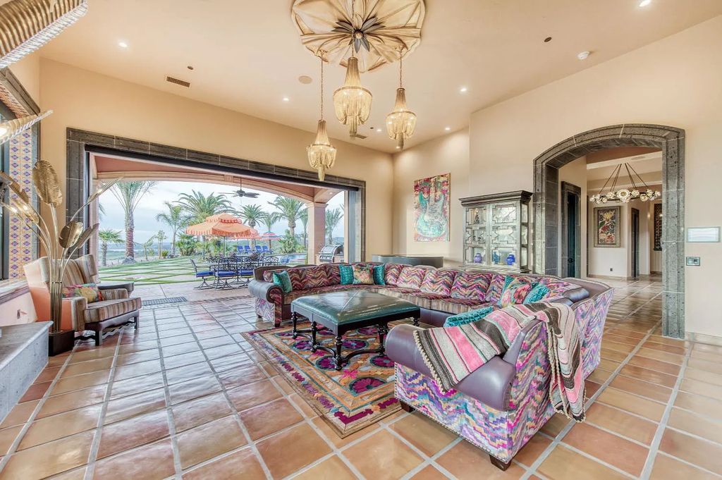 22137 Oak Glen Lane, Friant, California is a newly constructed home boasts 360 degree views of the snow-capped Sierras, Millerton Lake, Eagle Springs Golf Course and the City, enjoying the massive resort-style pool which includes a waterslide, private grotto and recessed fire pit.