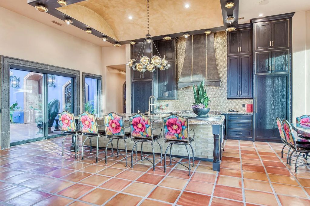 22137 Oak Glen Lane, Friant, California is a newly constructed home boasts 360 degree views of the snow-capped Sierras, Millerton Lake, Eagle Springs Golf Course and the City, enjoying the massive resort-style pool which includes a waterslide, private grotto and recessed fire pit.