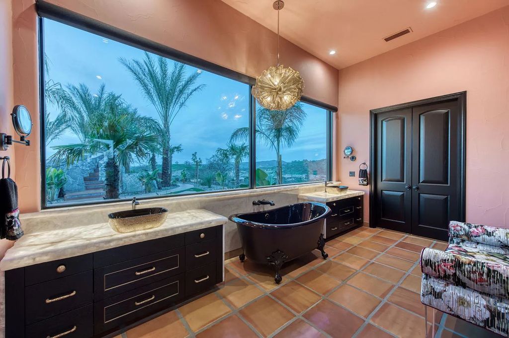 22137 Oak Glen Lane, Friant, California is a newly constructed home boasts 360 degree views of the snow-capped Sierras, Millerton Lake, Eagle Springs Golf Course and the City, enjoying the massive resort-style pool which includes a waterslide, private grotto and recessed fire pit.
