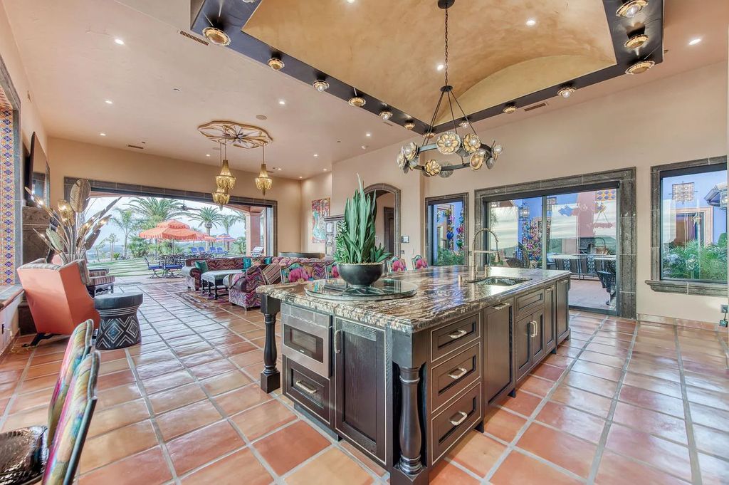 22137 Oak Glen Lane, Friant, California is a newly constructed home boasts 360 degree views of the snow-capped Sierras, Millerton Lake, Eagle Springs Golf Course and the City, enjoying the massive resort-style pool which includes a waterslide, private grotto and recessed fire pit.