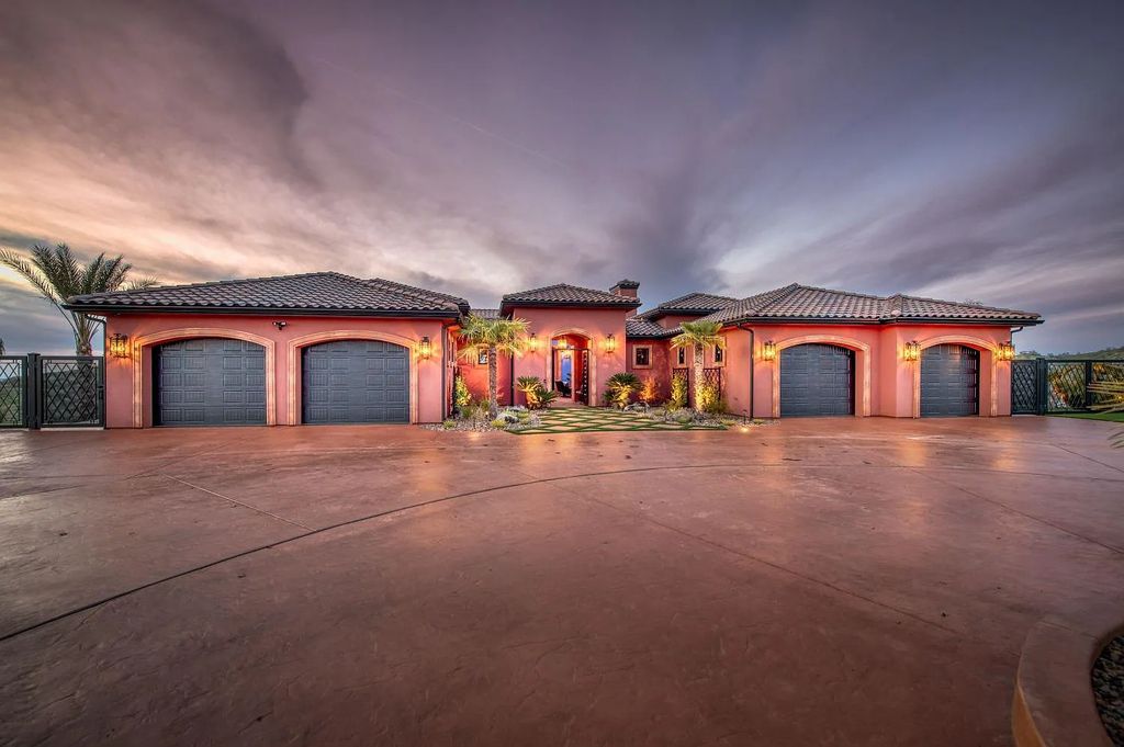 22137 Oak Glen Lane, Friant, California is a newly constructed home boasts 360 degree views of the snow-capped Sierras, Millerton Lake, Eagle Springs Golf Course and the City, enjoying the massive resort-style pool which includes a waterslide, private grotto and recessed fire pit.