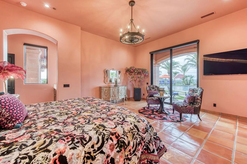 22137 Oak Glen Lane, Friant, California is a newly constructed home boasts 360 degree views of the snow-capped Sierras, Millerton Lake, Eagle Springs Golf Course and the City, enjoying the massive resort-style pool which includes a waterslide, private grotto and recessed fire pit.