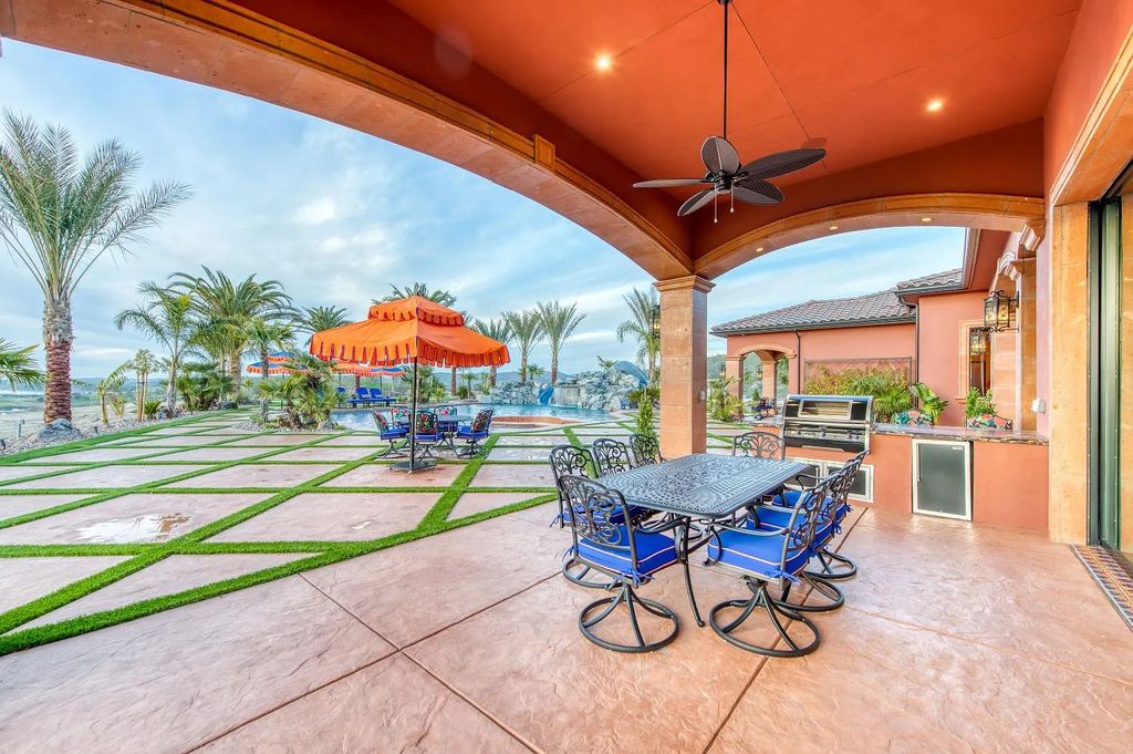 22137 Oak Glen Lane, Friant, California is a newly constructed home boasts 360 degree views of the snow-capped Sierras, Millerton Lake, Eagle Springs Golf Course and the City, enjoying the massive resort-style pool which includes a waterslide, private grotto and recessed fire pit.