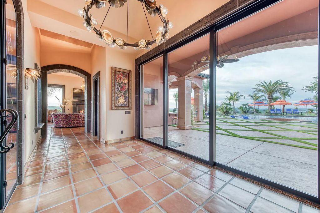 22137 Oak Glen Lane, Friant, California is a newly constructed home boasts 360 degree views of the snow-capped Sierras, Millerton Lake, Eagle Springs Golf Course and the City, enjoying the massive resort-style pool which includes a waterslide, private grotto and recessed fire pit.