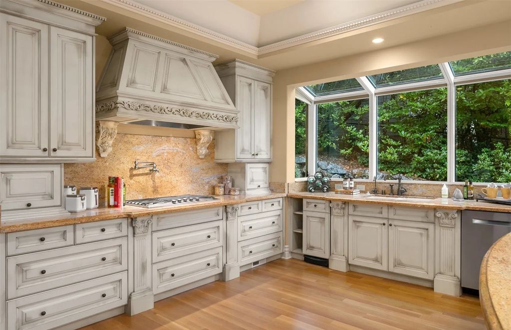 The Estate in Hunts Point was designed with rooms to be enjoyed by incorporating classic finishes and custom detailing throughout, now available for sale. This home located at 3210 Hunts Point Road, Hunts Point, Washington