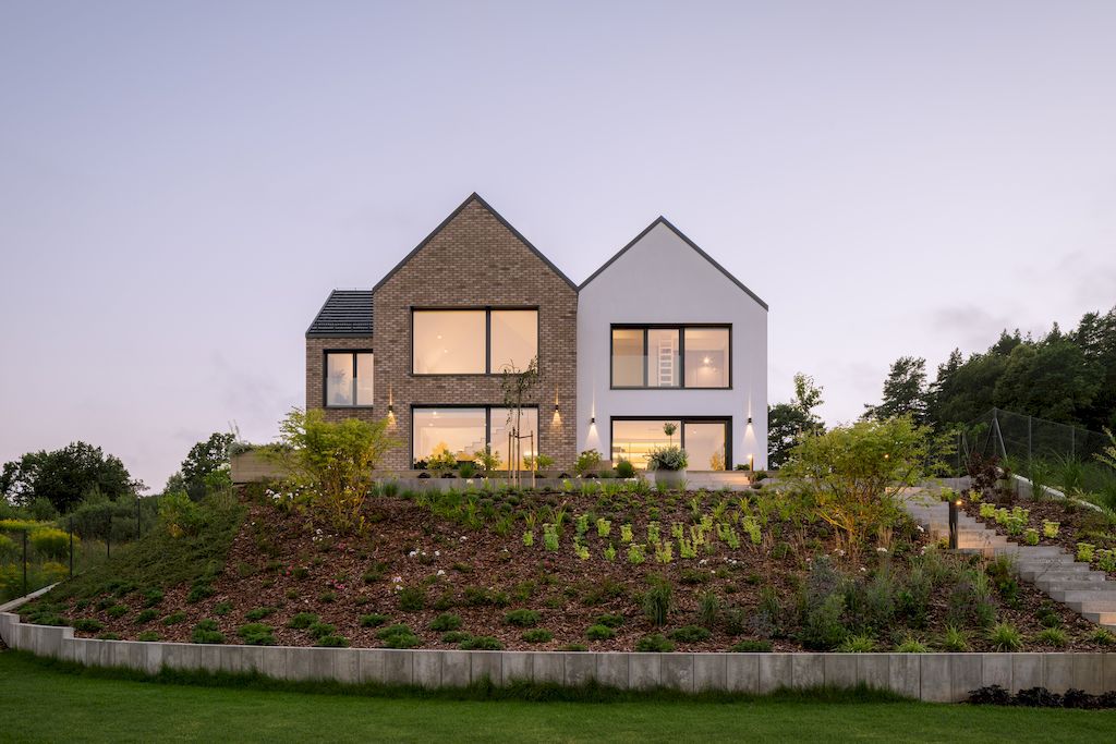 Multi Gable House with Picturesque Views of forest in Brazil by bkm group