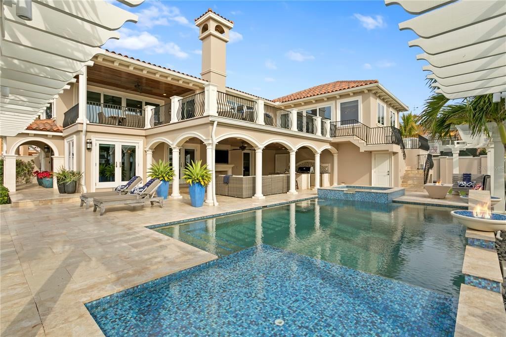 1103 Gulf Way, Saint Pete Beach, Florida is the ultimate beachfront retreat with the interior spaces are generous, the outdoor spaces are tremendous and the surrounding area creates a perfect place for Fun with Family and Friends.