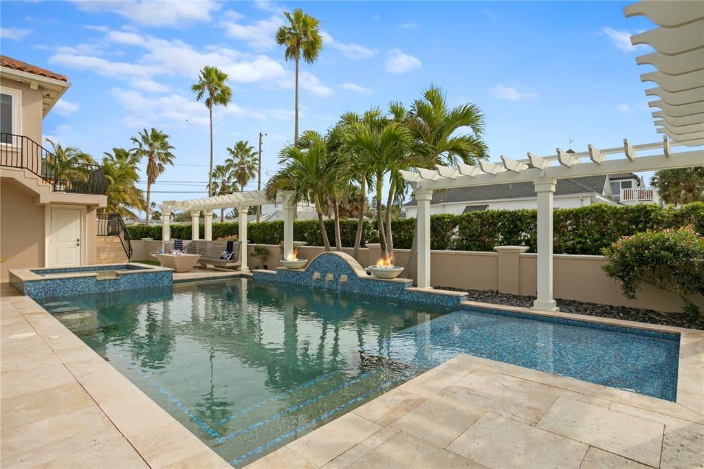 1103 Gulf Way, Saint Pete Beach, Florida is the ultimate beachfront retreat with the interior spaces are generous, the outdoor spaces are tremendous and the surrounding area creates a perfect place for Fun with Family and Friends.