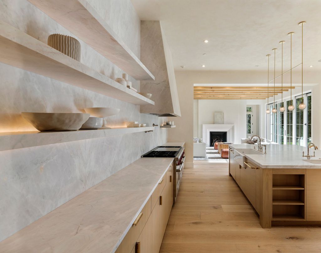14830 Pampas Ricas Boulevard, Pacific Palisades, California is artfully designed and sophisticated estate flooded with an array of warmth and light through its thoughtfully executed floor plan displaying a masterful fusion of high-quality materials and unparalleled finishes.