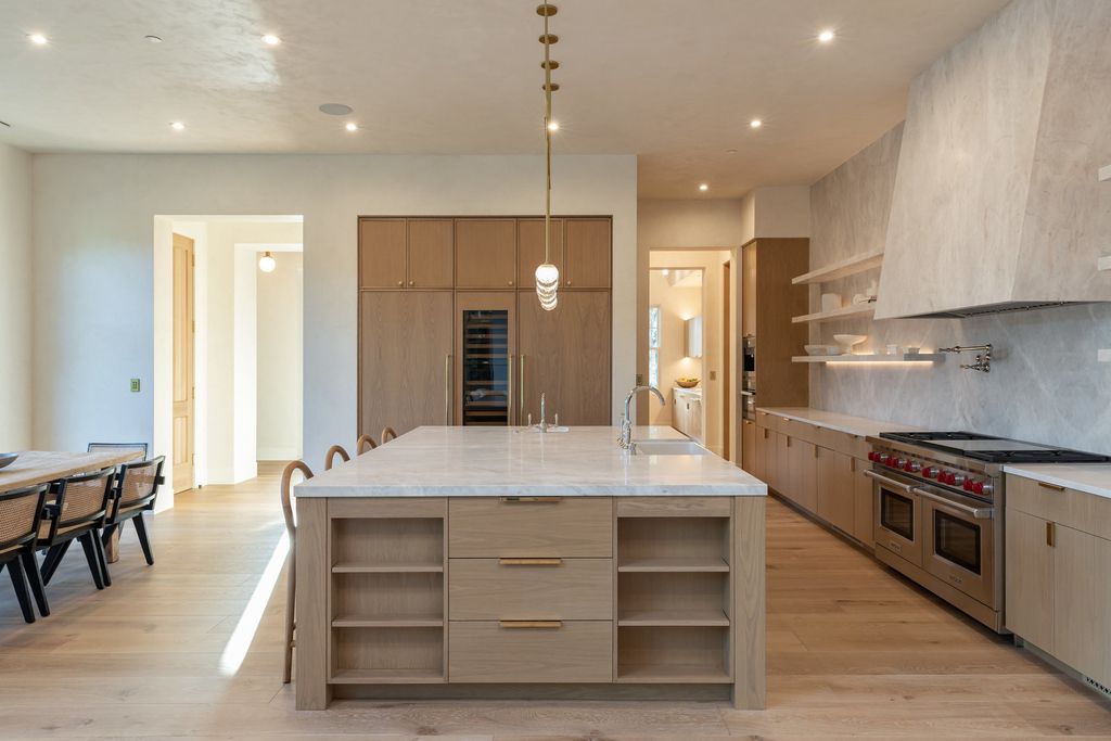 14830 Pampas Ricas Boulevard, Pacific Palisades, California is artfully designed and sophisticated estate flooded with an array of warmth and light through its thoughtfully executed floor plan displaying a masterful fusion of high-quality materials and unparalleled finishes.