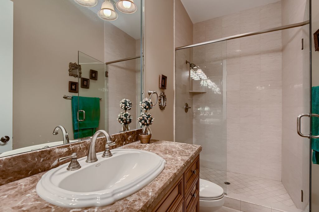 1278 Imperia Drive, Henderson, Nevada is a custom home in the exclusive guard gated community of Rapallo in Seven Hills, wrapped in lush green sculptured landscape in front and back.