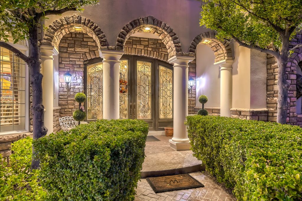 1278 Imperia Drive, Henderson, Nevada is a custom home in the exclusive guard gated community of Rapallo in Seven Hills, wrapped in lush green sculptured landscape in front and back.