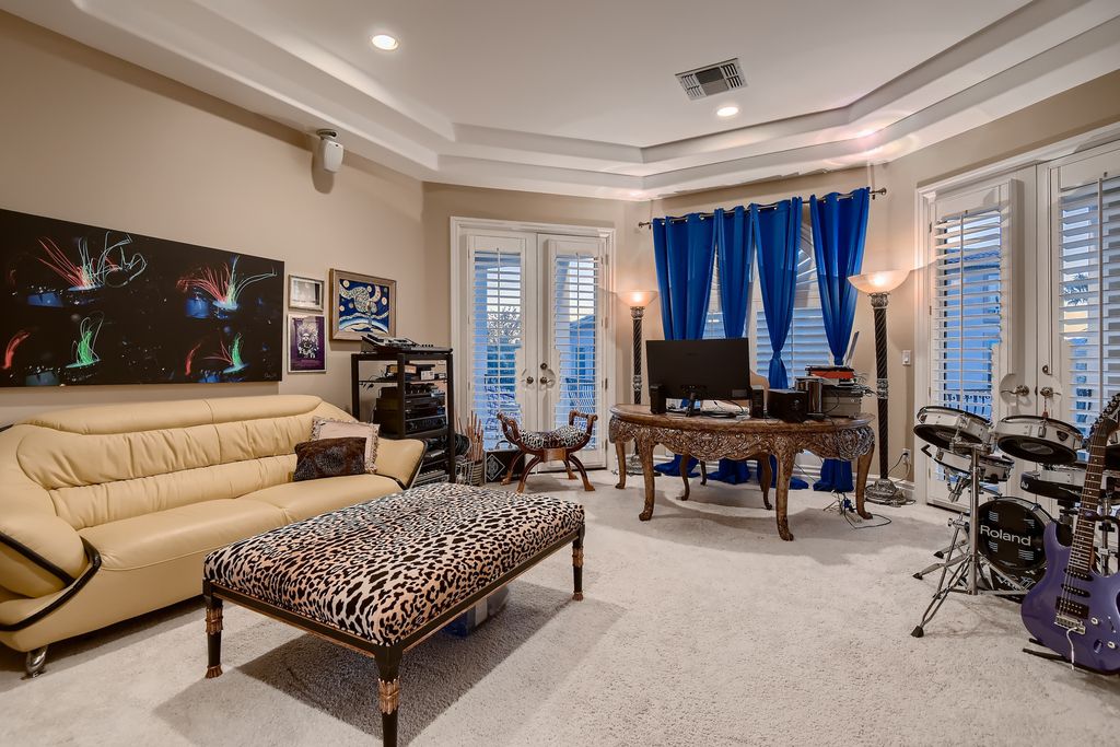 1278 Imperia Drive, Henderson, Nevada is a custom home in the exclusive guard gated community of Rapallo in Seven Hills, wrapped in lush green sculptured landscape in front and back.