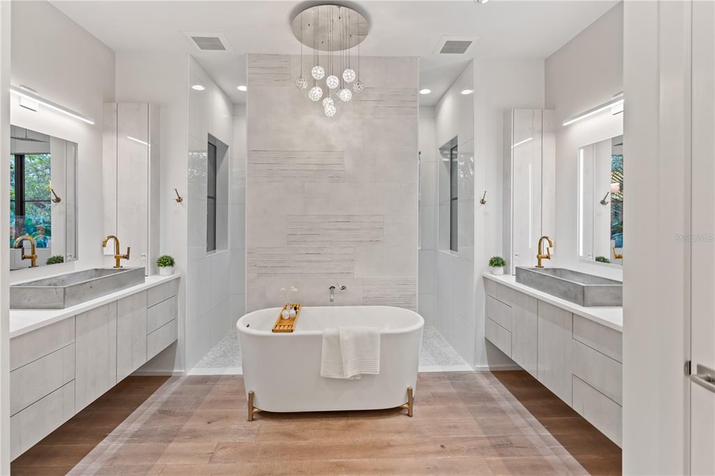 3940 Elysian Woods Lane, Sarasota, Florida is a mature landscaped estate is nestled on 1.47 acres and completely private in a small, gated community with only eight homes, was built with meticulous craftsmanship and bespoke finishes throughout.