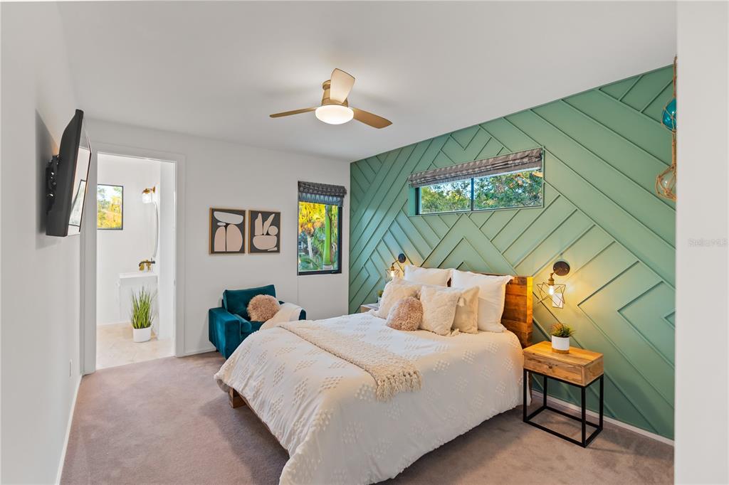 3940 Elysian Woods Lane, Sarasota, Florida is a mature landscaped estate is nestled on 1.47 acres and completely private in a small, gated community with only eight homes, was built with meticulous craftsmanship and bespoke finishes throughout.