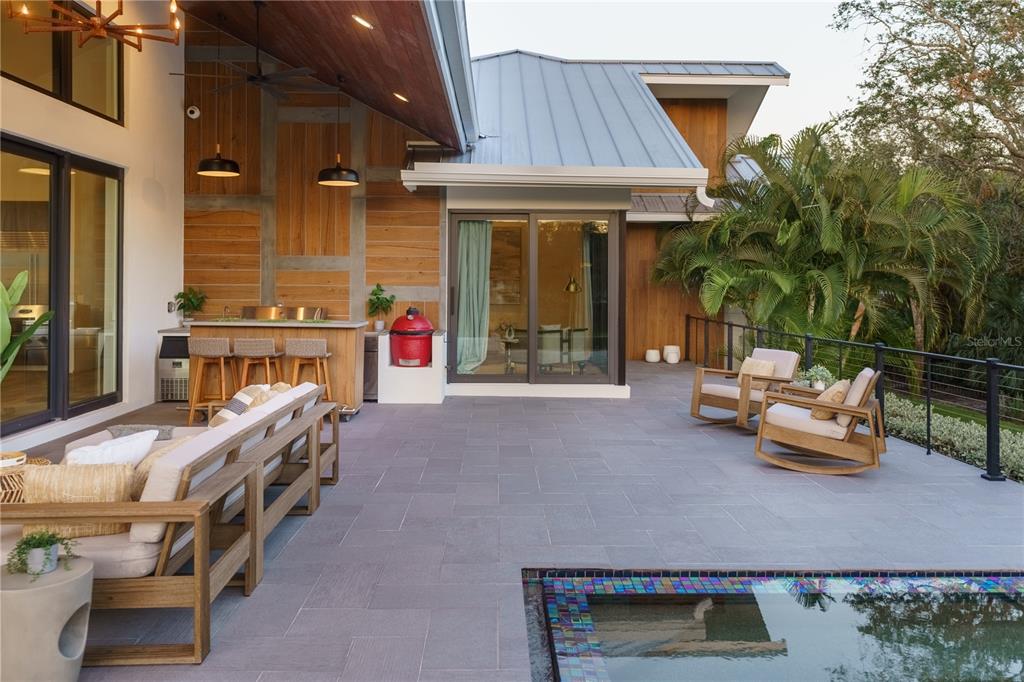 3940 Elysian Woods Lane, Sarasota, Florida is a mature landscaped estate is nestled on 1.47 acres and completely private in a small, gated community with only eight homes, was built with meticulous craftsmanship and bespoke finishes throughout.