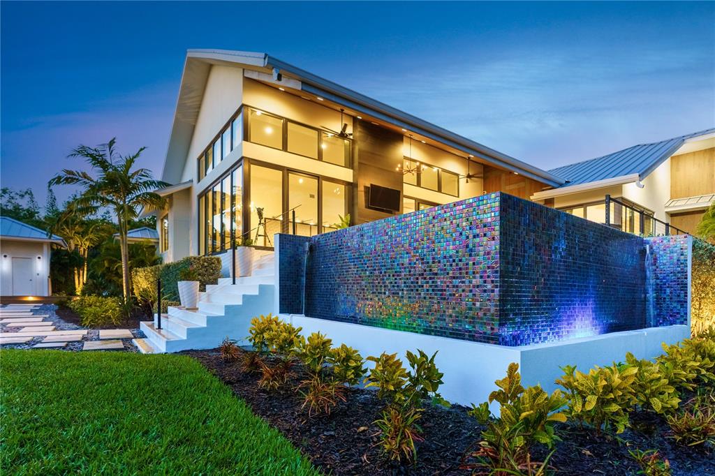 3940 Elysian Woods Lane, Sarasota, Florida is a mature landscaped estate is nestled on 1.47 acres and completely private in a small, gated community with only eight homes, was built with meticulous craftsmanship and bespoke finishes throughout.
