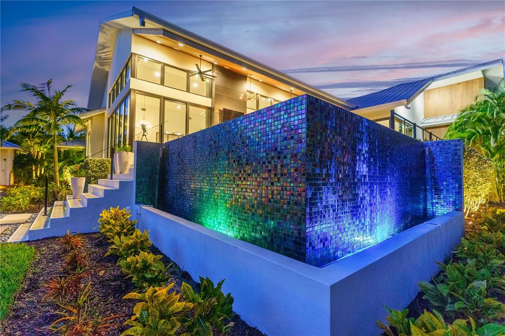 3940 Elysian Woods Lane, Sarasota, Florida is a mature landscaped estate is nestled on 1.47 acres and completely private in a small, gated community with only eight homes, was built with meticulous craftsmanship and bespoke finishes throughout.