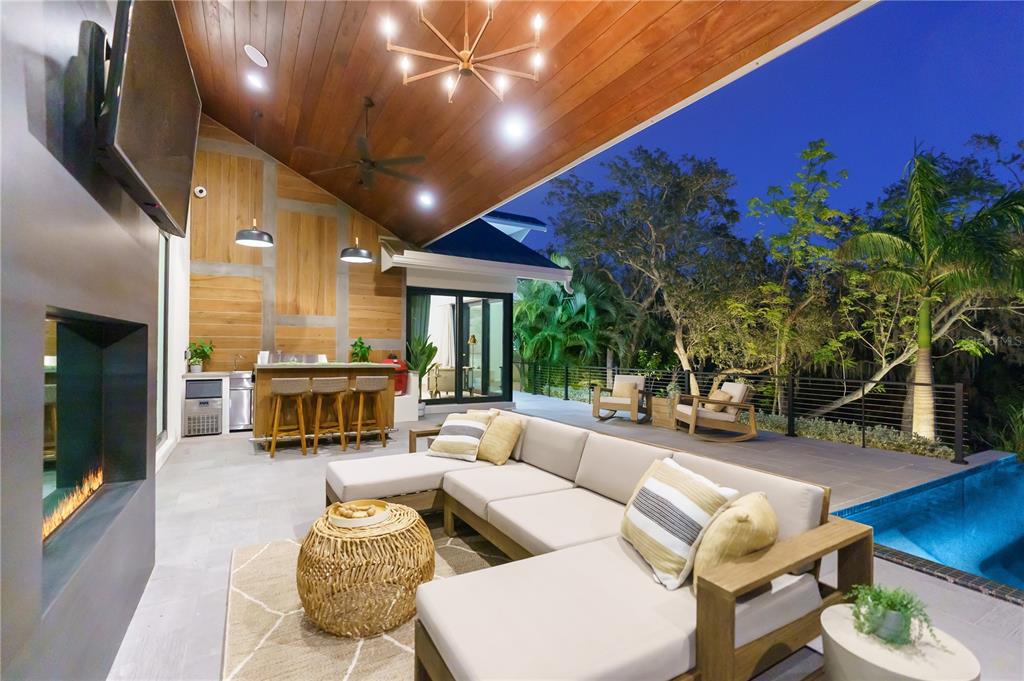3940 Elysian Woods Lane, Sarasota, Florida is a mature landscaped estate is nestled on 1.47 acres and completely private in a small, gated community with only eight homes, was built with meticulous craftsmanship and bespoke finishes throughout.