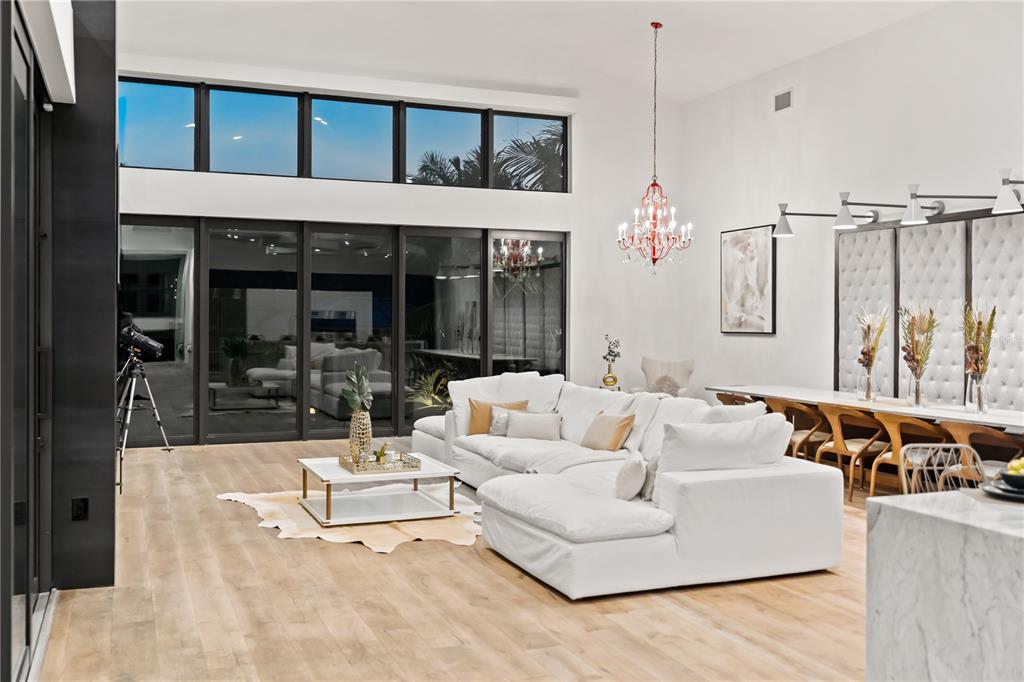 3940 Elysian Woods Lane, Sarasota, Florida is a mature landscaped estate is nestled on 1.47 acres and completely private in a small, gated community with only eight homes, was built with meticulous craftsmanship and bespoke finishes throughout.