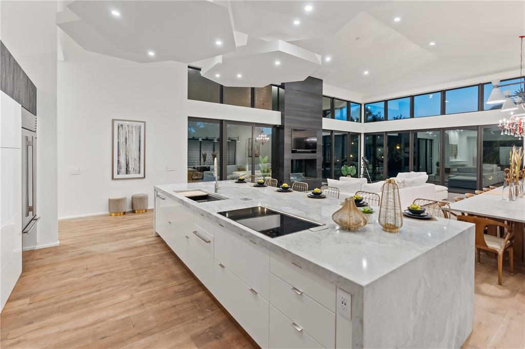 3940 Elysian Woods Lane, Sarasota, Florida is a mature landscaped estate is nestled on 1.47 acres and completely private in a small, gated community with only eight homes, was built with meticulous craftsmanship and bespoke finishes throughout.