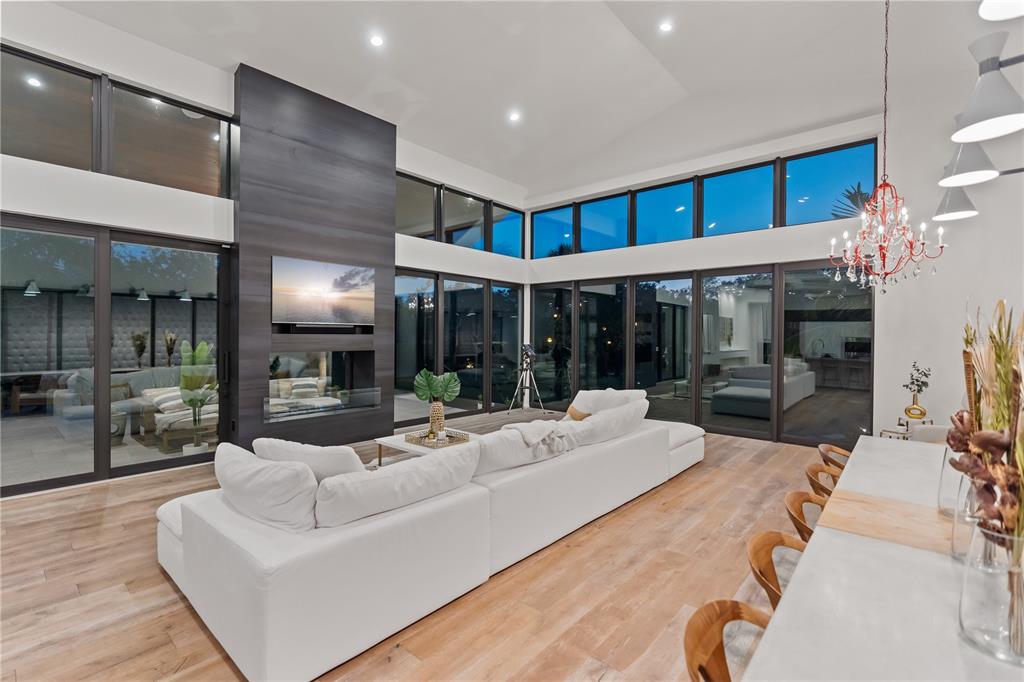 3940 Elysian Woods Lane, Sarasota, Florida is a mature landscaped estate is nestled on 1.47 acres and completely private in a small, gated community with only eight homes, was built with meticulous craftsmanship and bespoke finishes throughout.