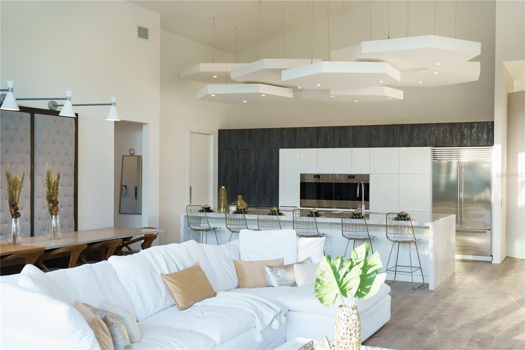 3940 Elysian Woods Lane, Sarasota, Florida is a mature landscaped estate is nestled on 1.47 acres and completely private in a small, gated community with only eight homes, was built with meticulous craftsmanship and bespoke finishes throughout.