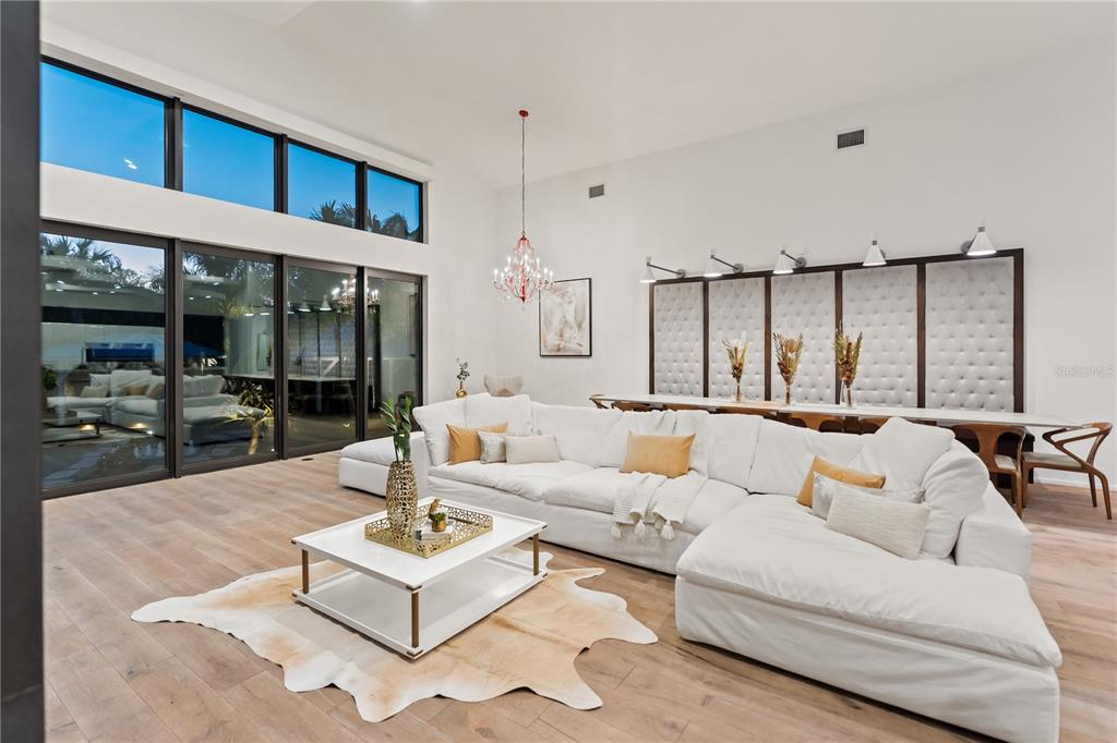 3940 Elysian Woods Lane, Sarasota, Florida is a mature landscaped estate is nestled on 1.47 acres and completely private in a small, gated community with only eight homes, was built with meticulous craftsmanship and bespoke finishes throughout.