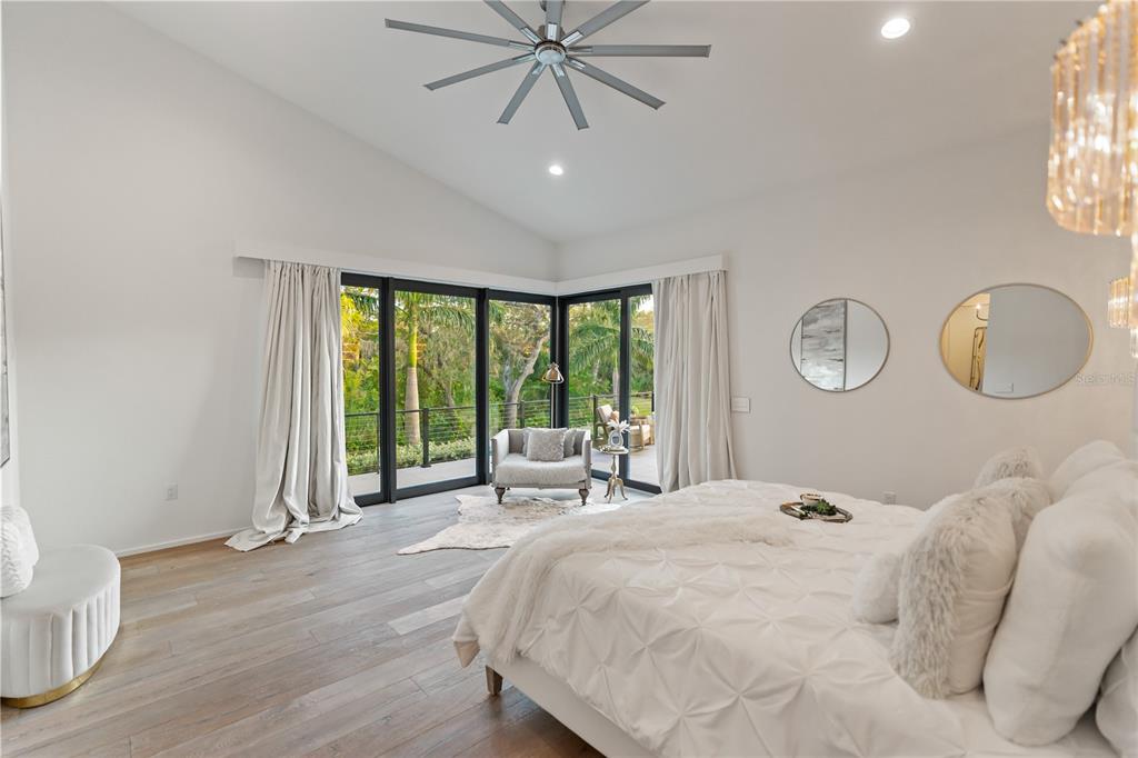 3940 Elysian Woods Lane, Sarasota, Florida is a mature landscaped estate is nestled on 1.47 acres and completely private in a small, gated community with only eight homes, was built with meticulous craftsmanship and bespoke finishes throughout.
