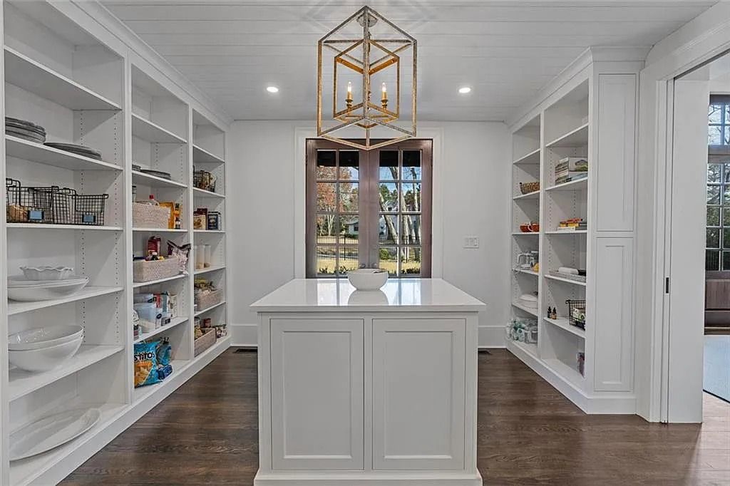 The House in Atlanta offers the lush green resort-style outdoor living with the saltwater heated pool and spa, dramatic lounge-side fireplace, and more now available for sale. This home located at 172 Blackland Dr NW, Atlanta, Georgia