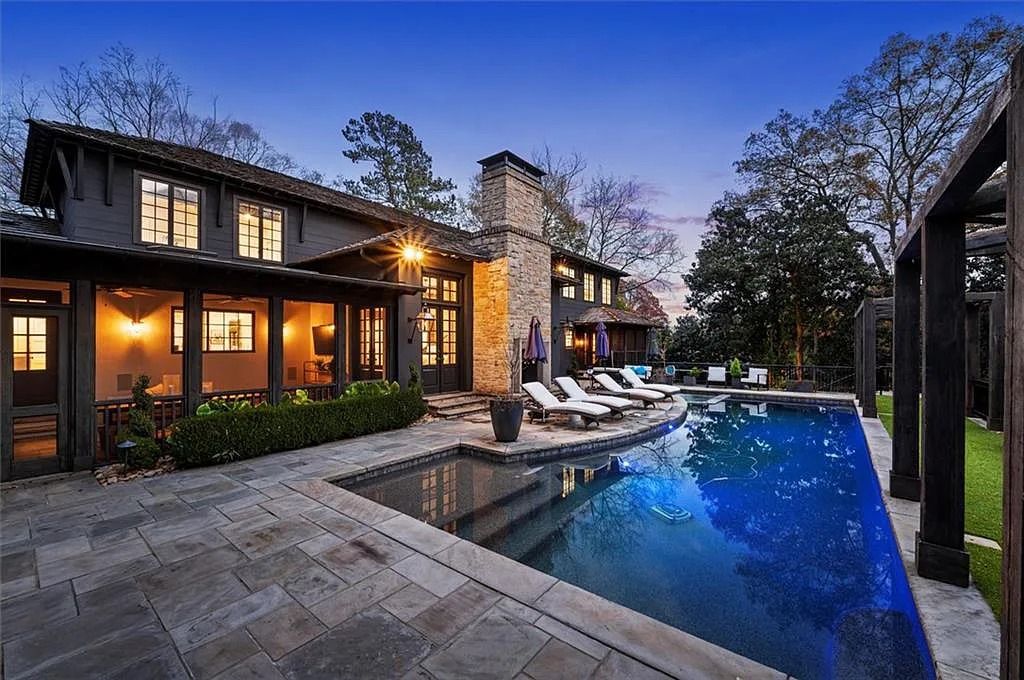 The House in Atlanta offers the lush green resort-style outdoor living with the saltwater heated pool and spa, dramatic lounge-side fireplace, and more now available for sale. This home located at 172 Blackland Dr NW, Atlanta, Georgia