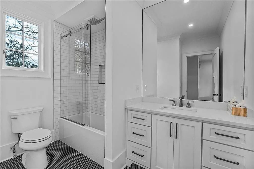 The House in Atlanta offers the lush green resort-style outdoor living with the saltwater heated pool and spa, dramatic lounge-side fireplace, and more now available for sale. This home located at 172 Blackland Dr NW, Atlanta, Georgia