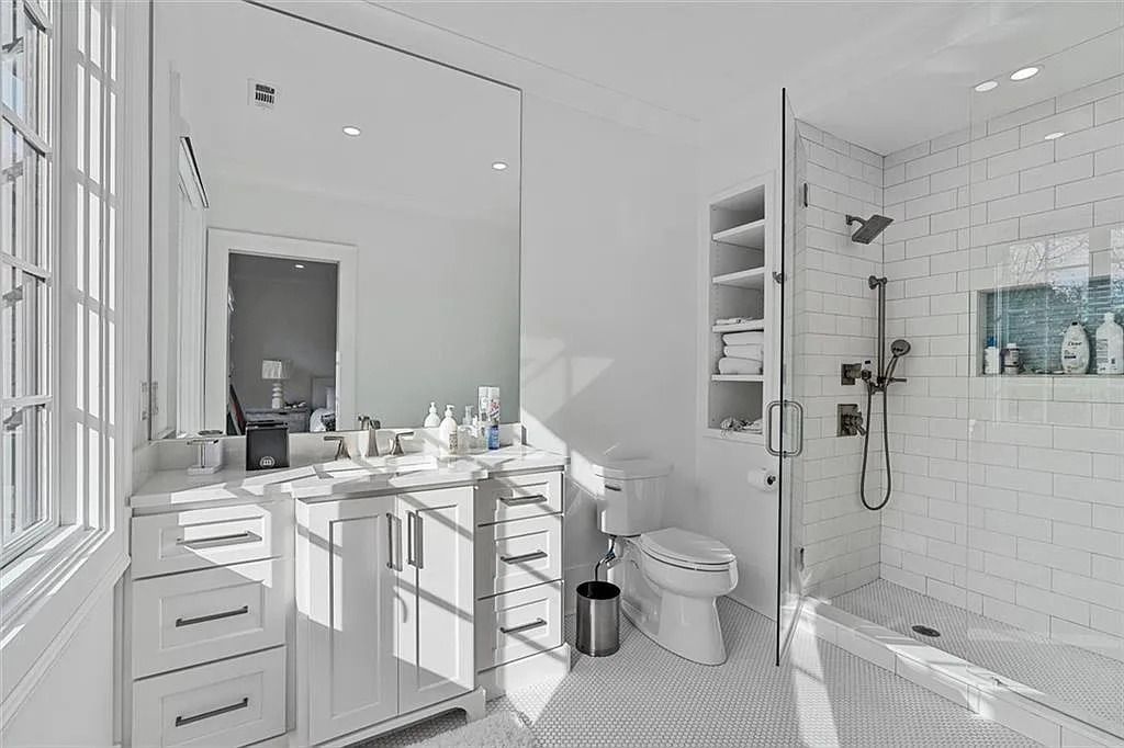 The House in Atlanta offers the lush green resort-style outdoor living with the saltwater heated pool and spa, dramatic lounge-side fireplace, and more now available for sale. This home located at 172 Blackland Dr NW, Atlanta, Georgia