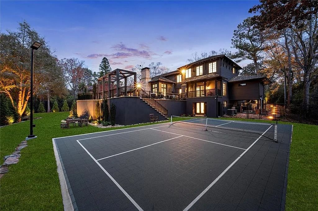 The House in Atlanta offers the lush green resort-style outdoor living with the saltwater heated pool and spa, dramatic lounge-side fireplace, and more now available for sale. This home located at 172 Blackland Dr NW, Atlanta, Georgia