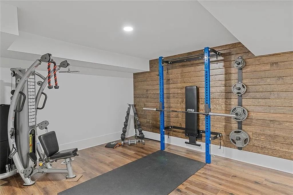 The House in Atlanta offers the lush green resort-style outdoor living with the saltwater heated pool and spa, dramatic lounge-side fireplace, and more now available for sale. This home located at 172 Blackland Dr NW, Atlanta, Georgia