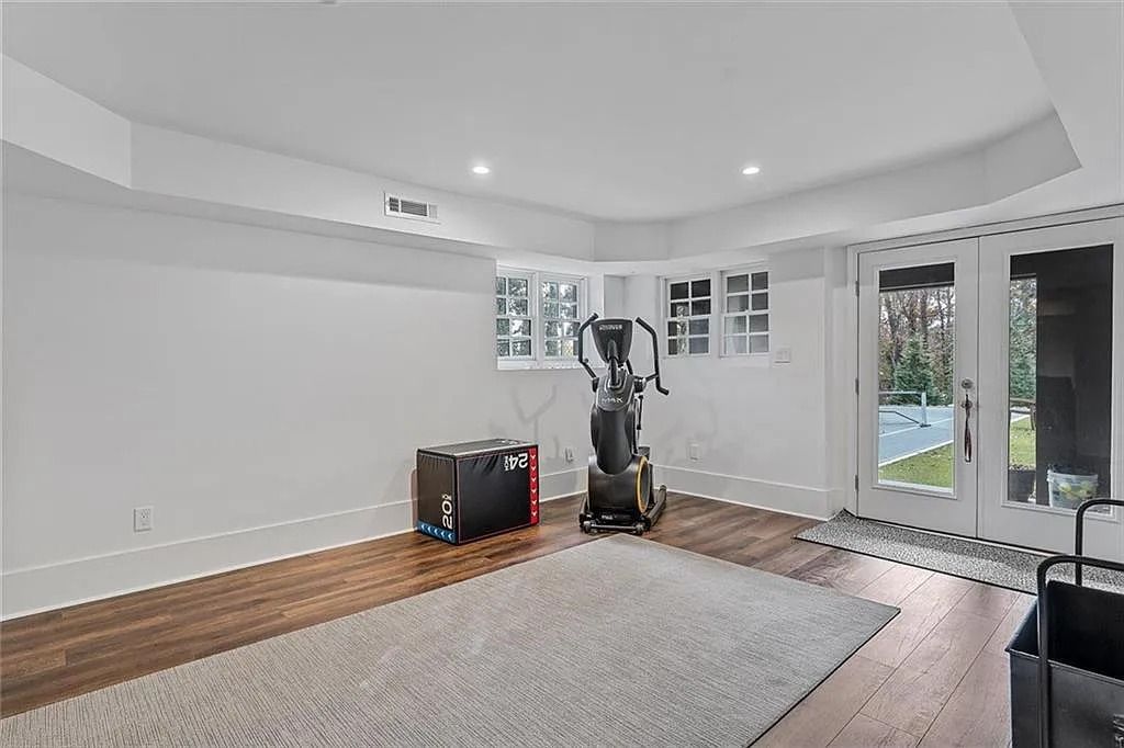 The House in Atlanta offers the lush green resort-style outdoor living with the saltwater heated pool and spa, dramatic lounge-side fireplace, and more now available for sale. This home located at 172 Blackland Dr NW, Atlanta, Georgia