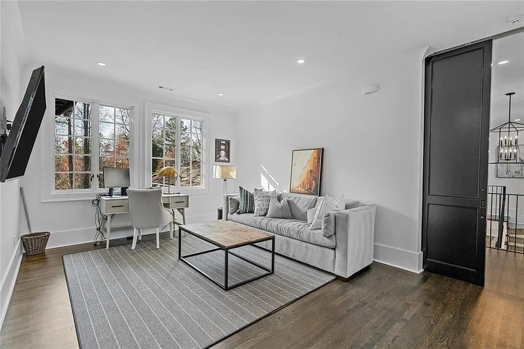 The House in Atlanta offers the lush green resort-style outdoor living with the saltwater heated pool and spa, dramatic lounge-side fireplace, and more now available for sale. This home located at 172 Blackland Dr NW, Atlanta, Georgia