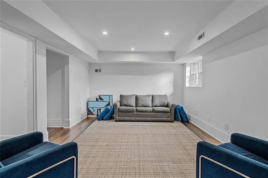 The House in Atlanta offers the lush green resort-style outdoor living with the saltwater heated pool and spa, dramatic lounge-side fireplace, and more now available for sale. This home located at 172 Blackland Dr NW, Atlanta, Georgia