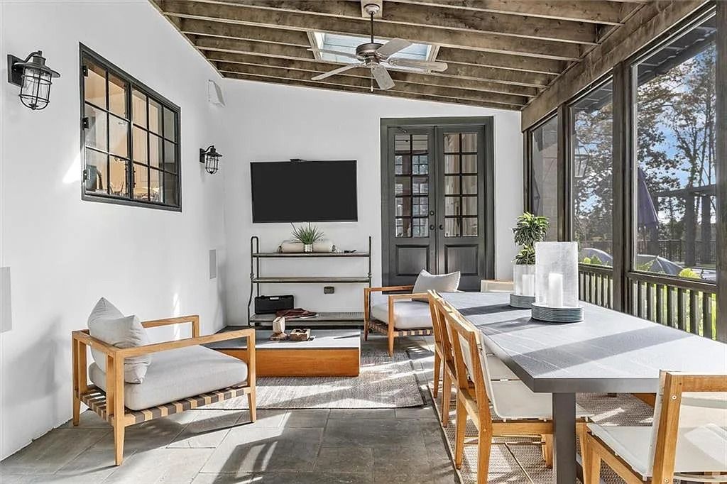 The House in Atlanta offers the lush green resort-style outdoor living with the saltwater heated pool and spa, dramatic lounge-side fireplace, and more now available for sale. This home located at 172 Blackland Dr NW, Atlanta, Georgia