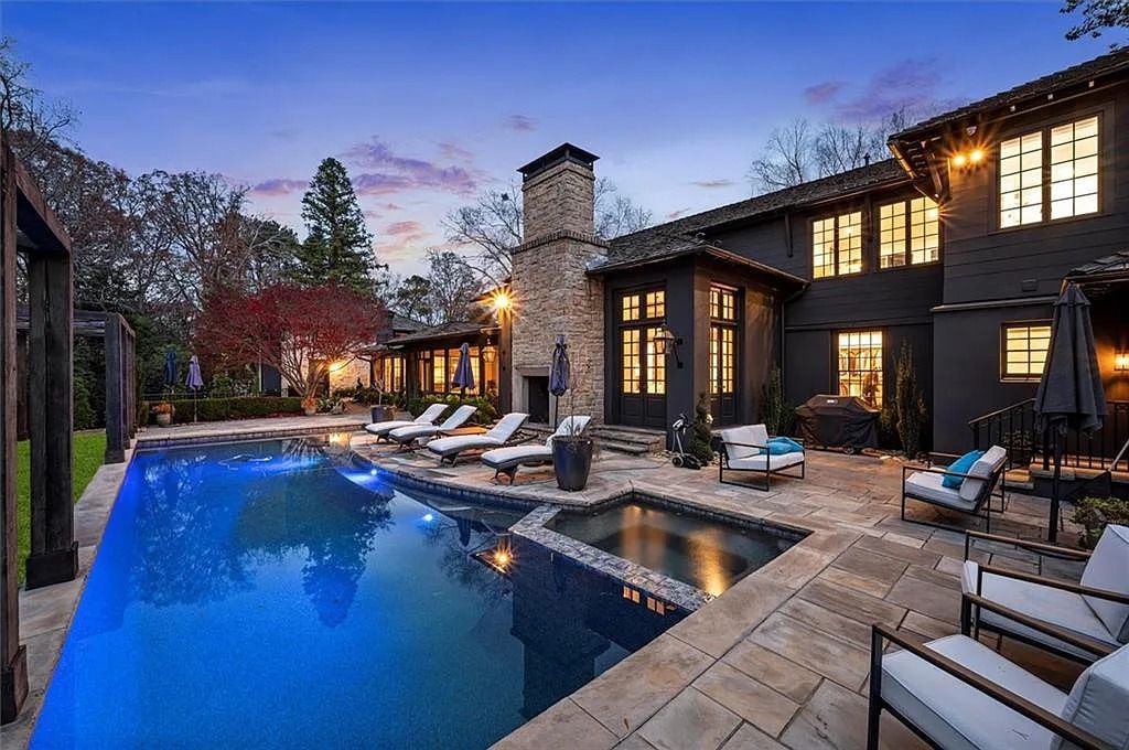 The House in Atlanta offers the lush green resort-style outdoor living with the saltwater heated pool and spa, dramatic lounge-side fireplace, and more now available for sale. This home located at 172 Blackland Dr NW, Atlanta, Georgia