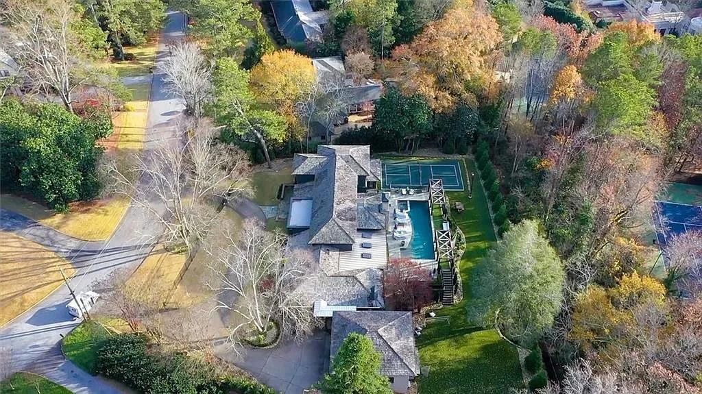 The House in Atlanta offers the lush green resort-style outdoor living with the saltwater heated pool and spa, dramatic lounge-side fireplace, and more now available for sale. This home located at 172 Blackland Dr NW, Atlanta, Georgia