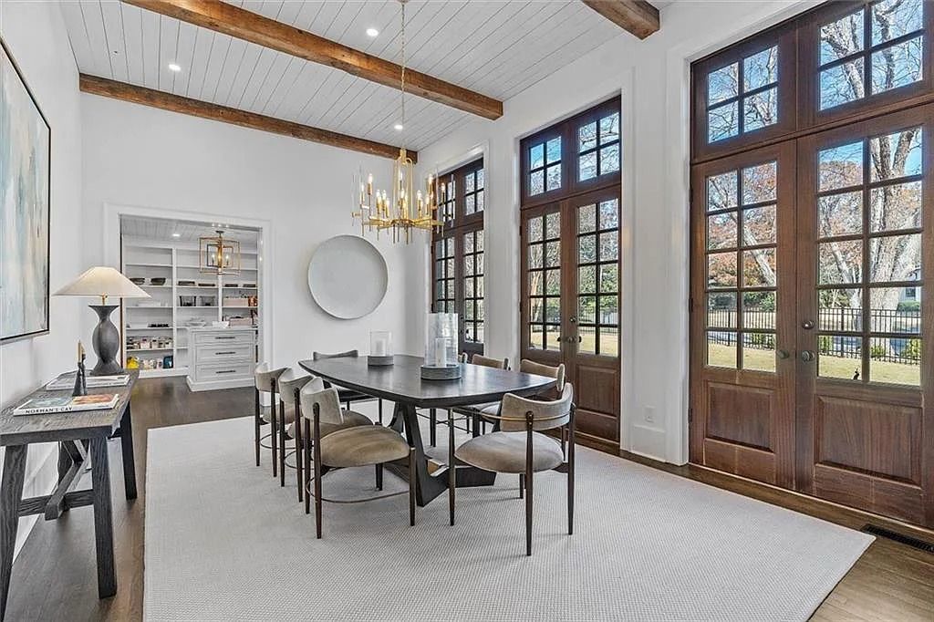 The House in Atlanta offers the lush green resort-style outdoor living with the saltwater heated pool and spa, dramatic lounge-side fireplace, and more now available for sale. This home located at 172 Blackland Dr NW, Atlanta, Georgia