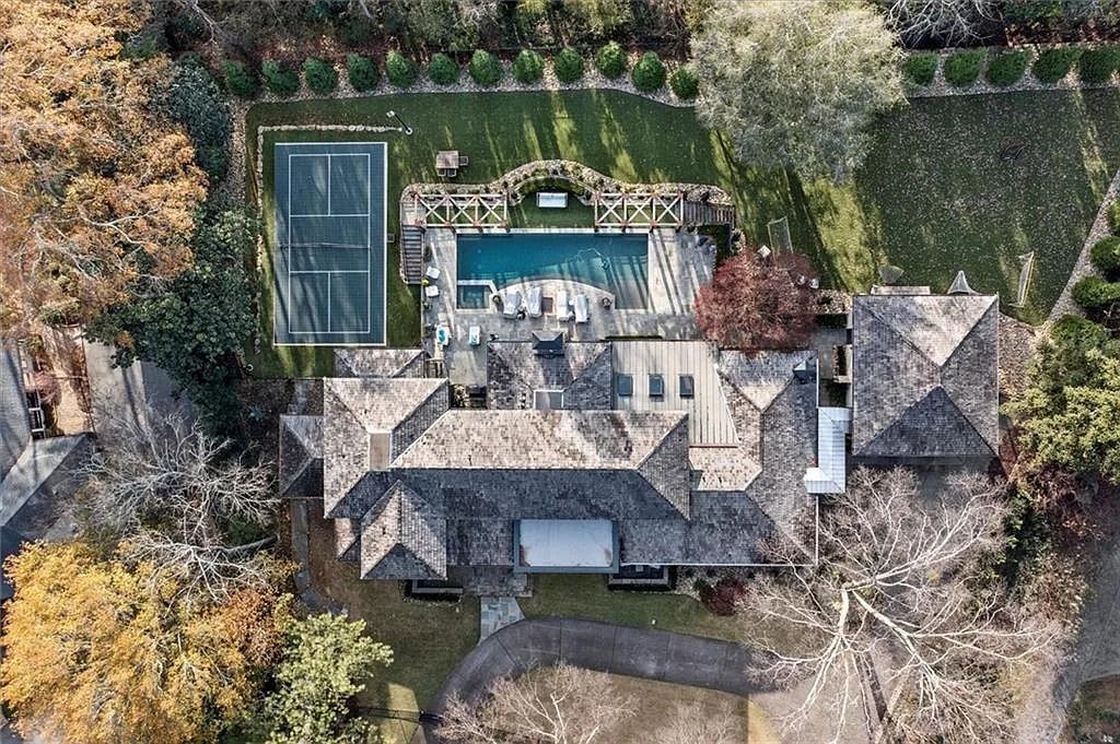 The House in Atlanta offers the lush green resort-style outdoor living with the saltwater heated pool and spa, dramatic lounge-side fireplace, and more now available for sale. This home located at 172 Blackland Dr NW, Atlanta, Georgia