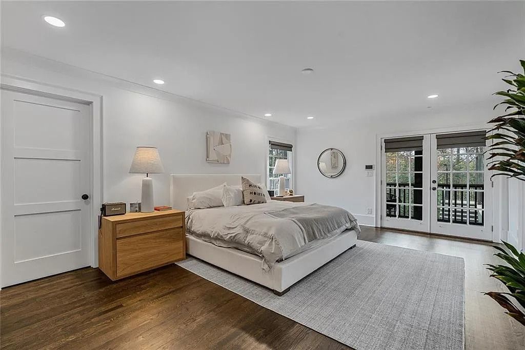 The House in Atlanta offers the lush green resort-style outdoor living with the saltwater heated pool and spa, dramatic lounge-side fireplace, and more now available for sale. This home located at 172 Blackland Dr NW, Atlanta, Georgia