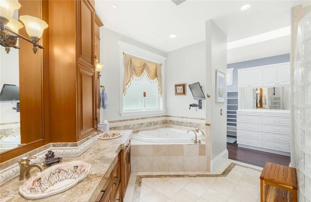 The Estate in Maple Valley boasts striking 22’ ceilings, library, home theater, gym, conference room, and an elevator to all three floors, now available for sale. This home located at 21145 212th Avenue SE, Maple Valley, Washington