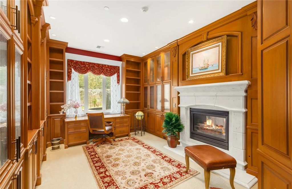 The Estate in Maple Valley boasts striking 22’ ceilings, library, home theater, gym, conference room, and an elevator to all three floors, now available for sale. This home located at 21145 212th Avenue SE, Maple Valley, Washington