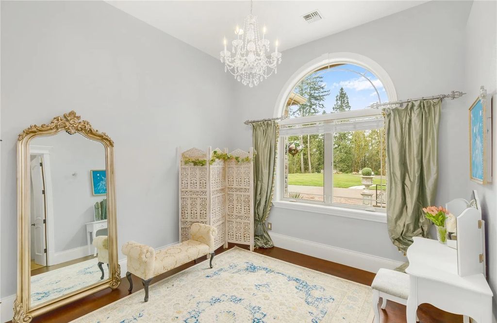 The Estate in Maple Valley boasts striking 22’ ceilings, library, home theater, gym, conference room, and an elevator to all three floors, now available for sale. This home located at 21145 212th Avenue SE, Maple Valley, Washington