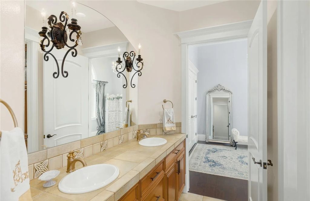 The Estate in Maple Valley boasts striking 22’ ceilings, library, home theater, gym, conference room, and an elevator to all three floors, now available for sale. This home located at 21145 212th Avenue SE, Maple Valley, Washington